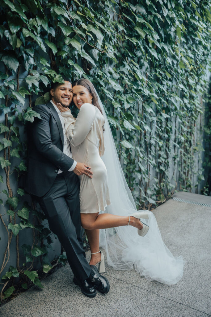 Couple against greenery Ponsonby Intimate Wedding